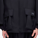 Close up of black jacket, showing texture of the PET-REC fabric