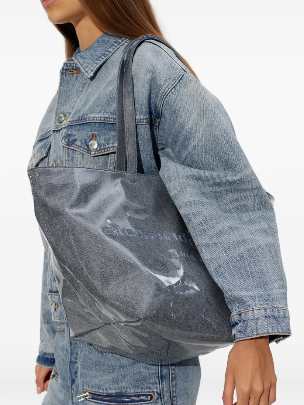 Gray tote bag worn by a person, showing the bag fit