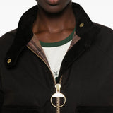Brown jacket worn by a person, showing the jacket fit