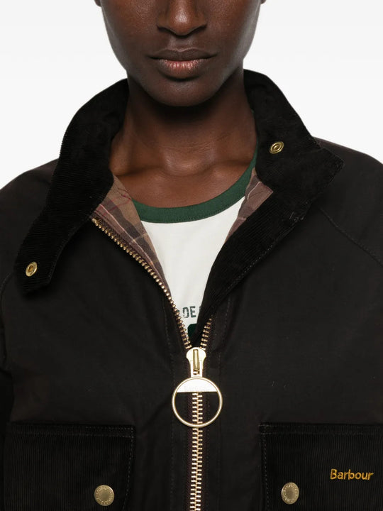 Brown jacket worn by a person, showing the jacket fit