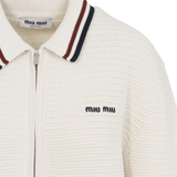 Close up of the White knitwear, showing texture of the cotton fabric