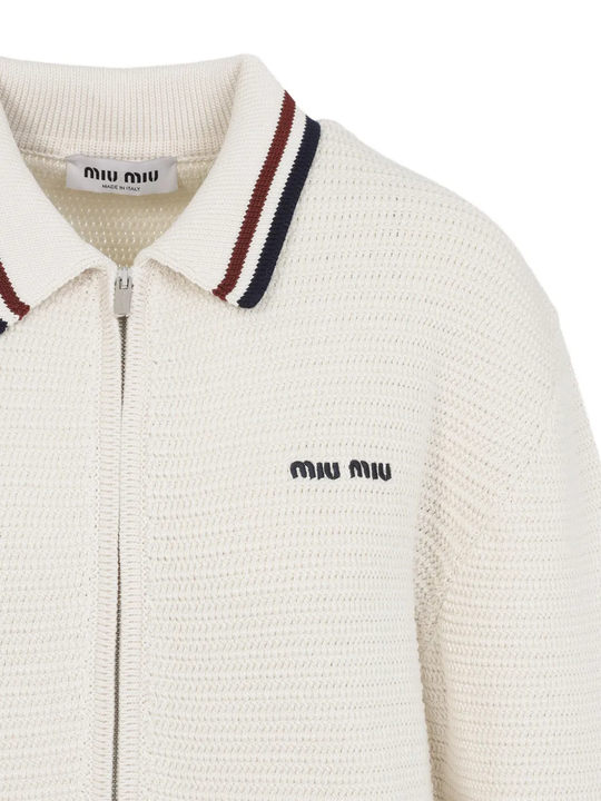 Close up of the White knitwear, showing texture of the cotton fabric