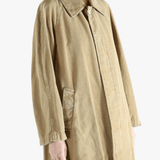 Tan jackets-coats worn by a person, showing the jackets-coats'fit