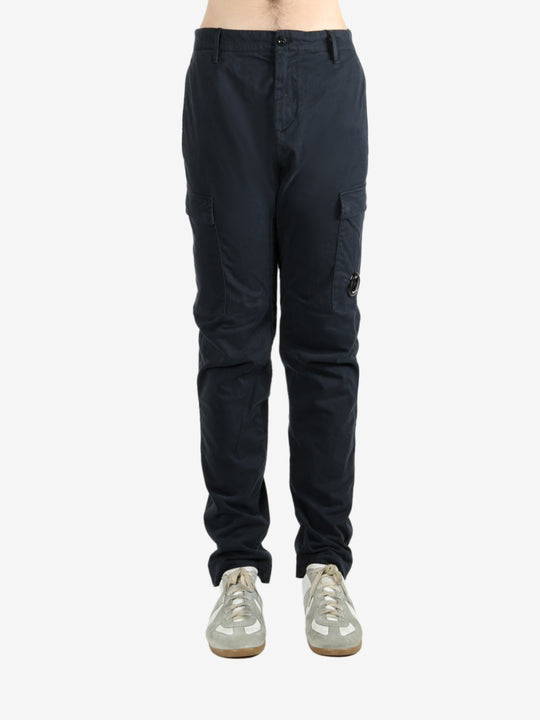 Blue pants worn by a person, showing the pants fit