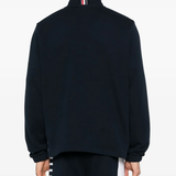 Navy pullover worn by a person, showing the pullover fit