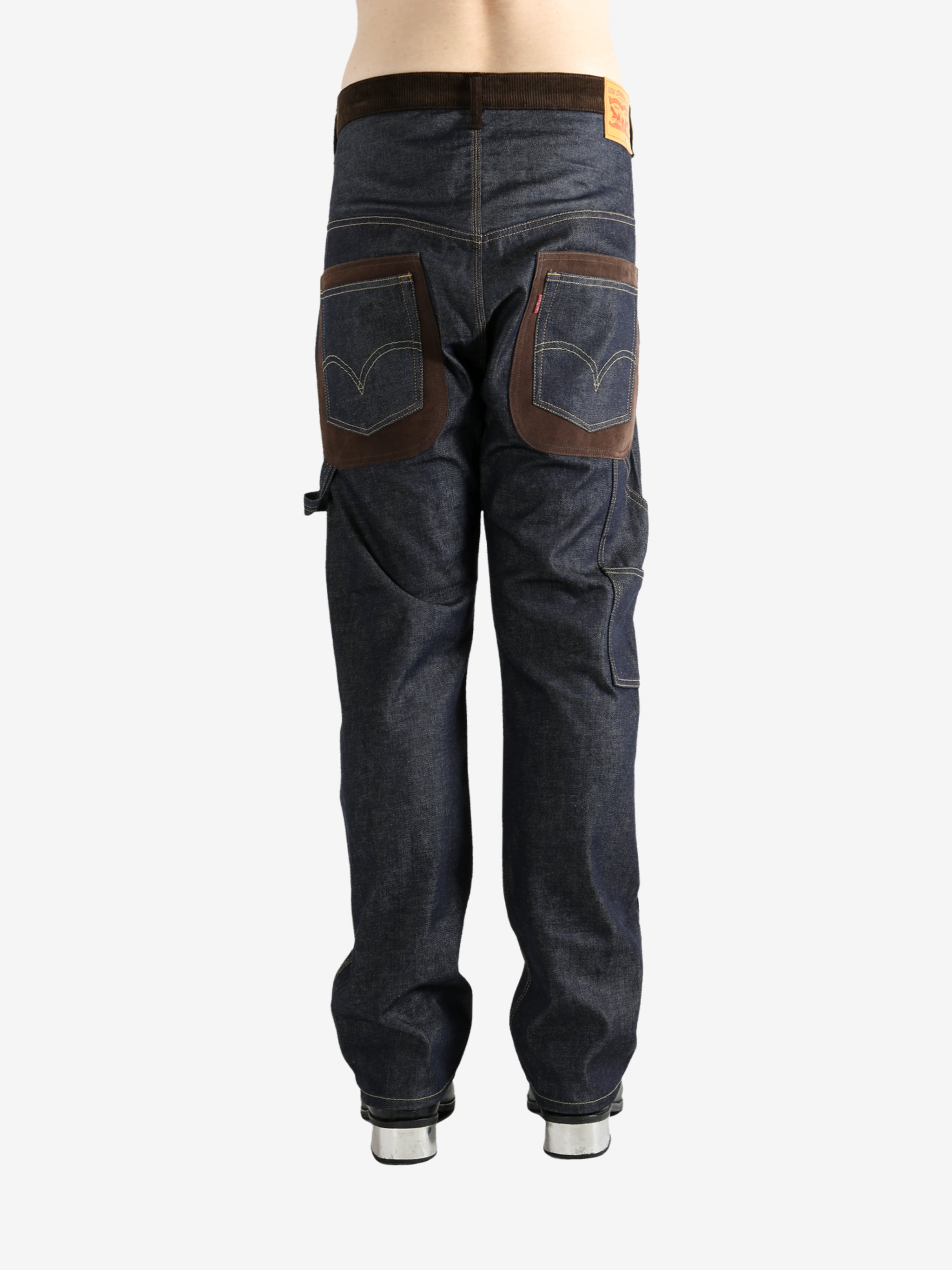 Blue jeans worn by a person, showing the jeans' fit