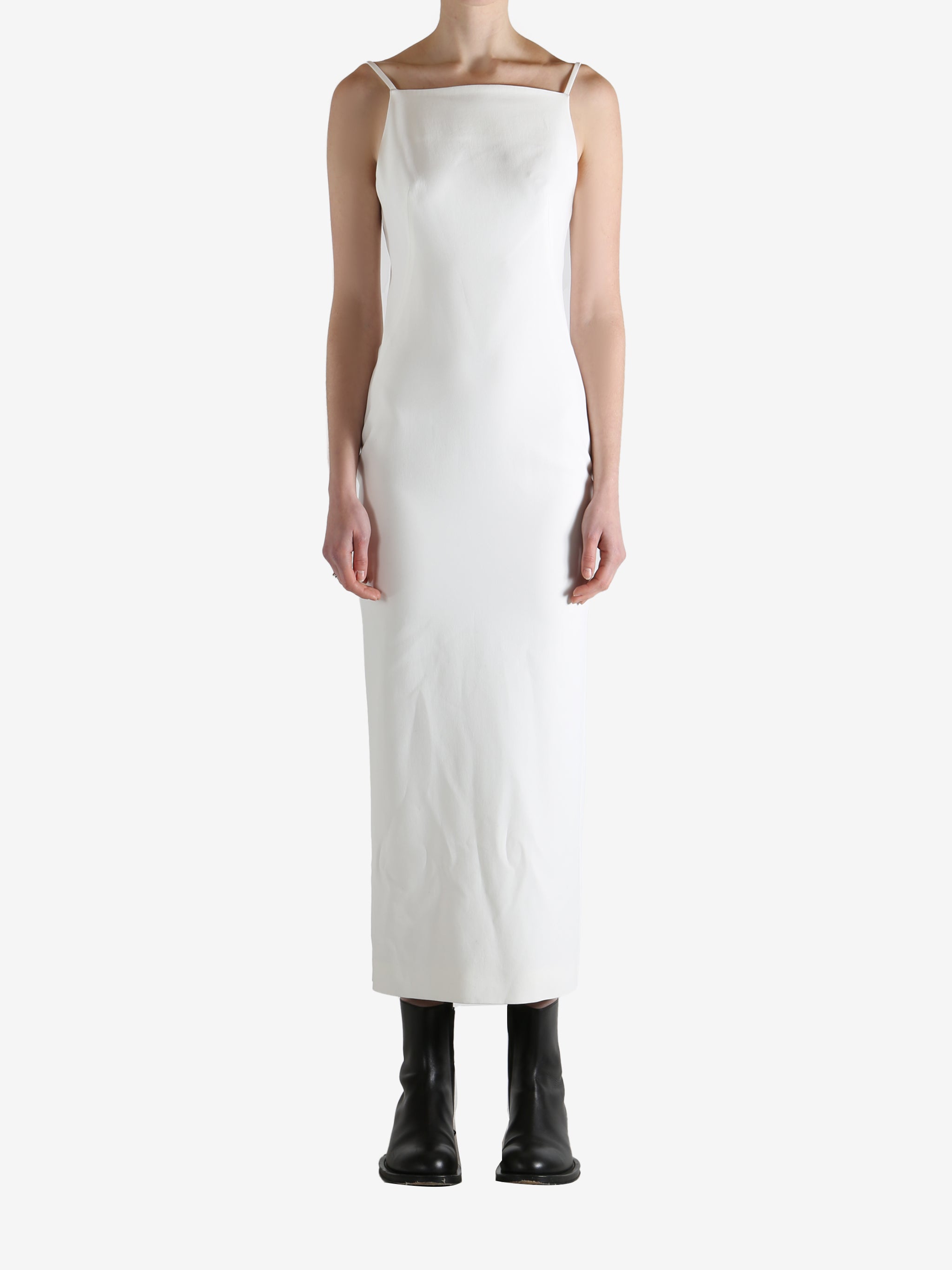 White dresses worn by a person, showing the dresses fit