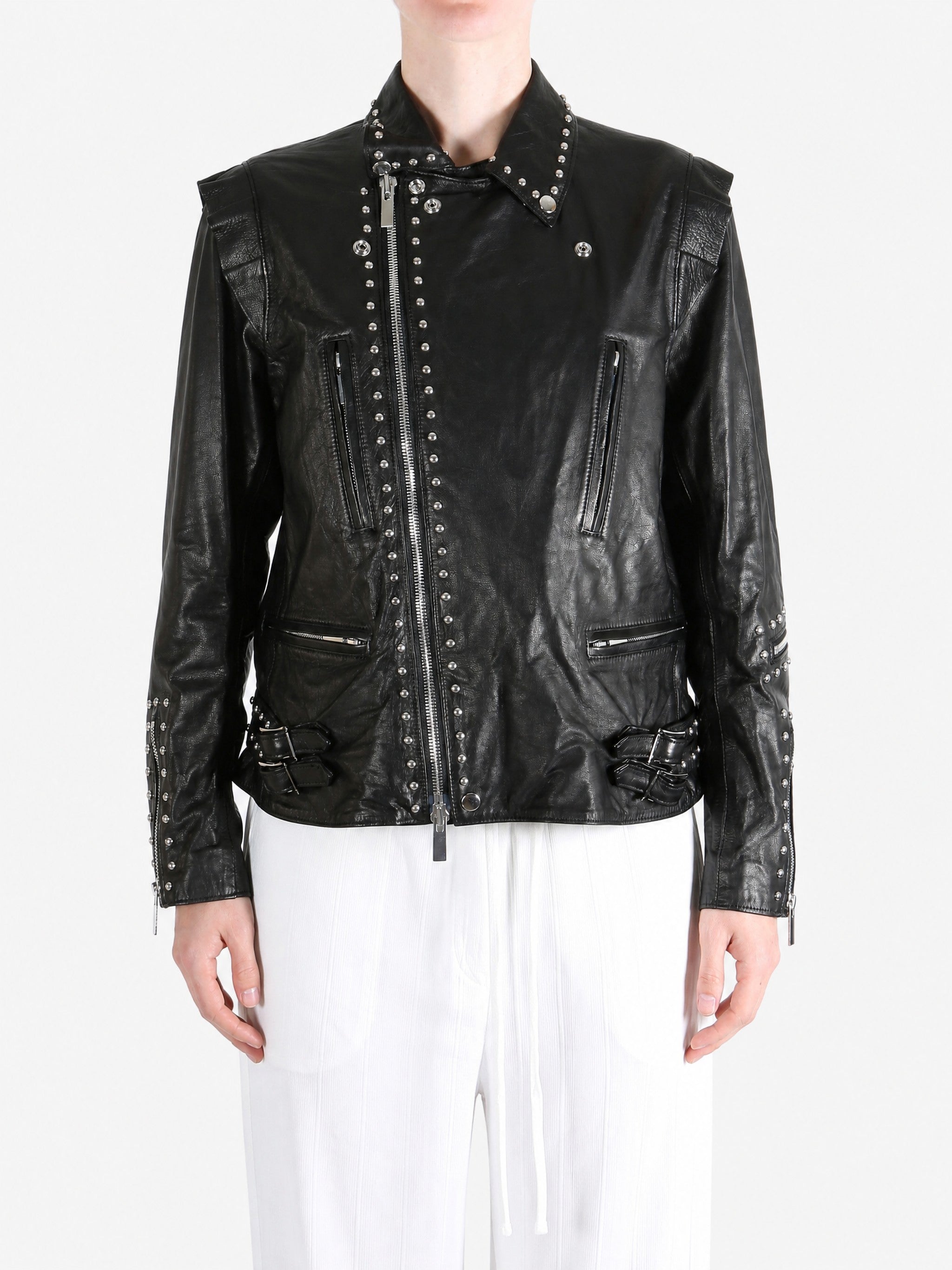 Black jacket worn by a person, showing the jacket fit