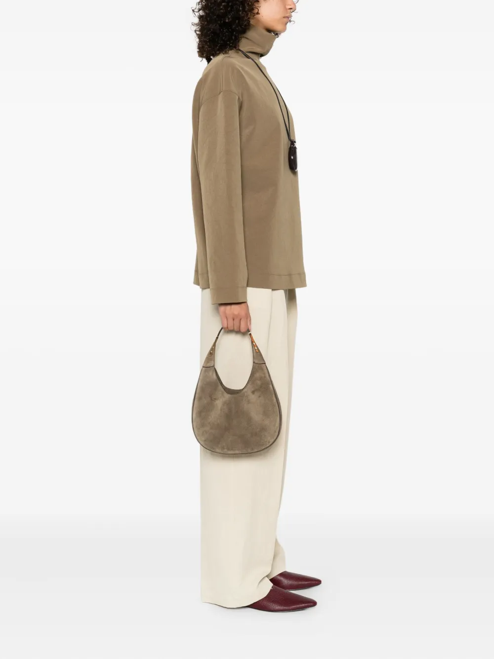 Grey bag worn by a person, showing the bag's fit