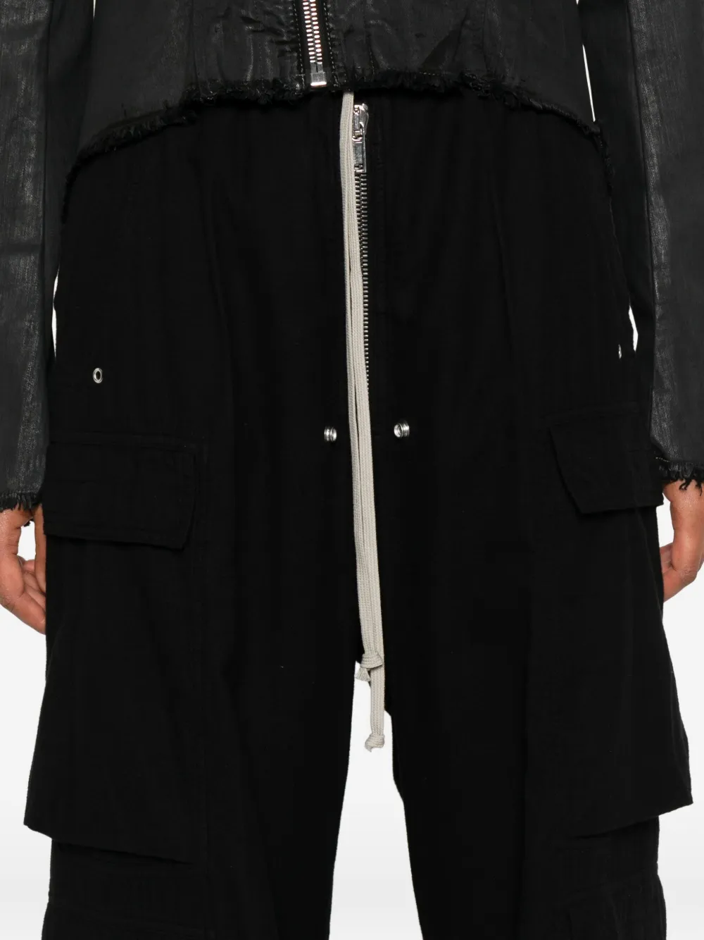 Close up of the black pants, showing texture of the cotton fabric