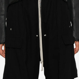 Close up of the black pants, showing texture of the cotton fabric