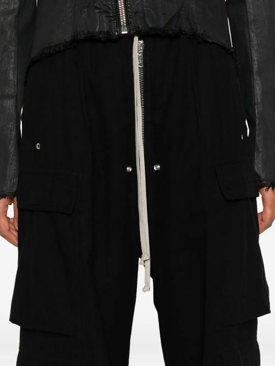 Close up of the black pants, showing texture of the cotton fabric