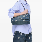 Blue bag worn by a person, showing the bag fit