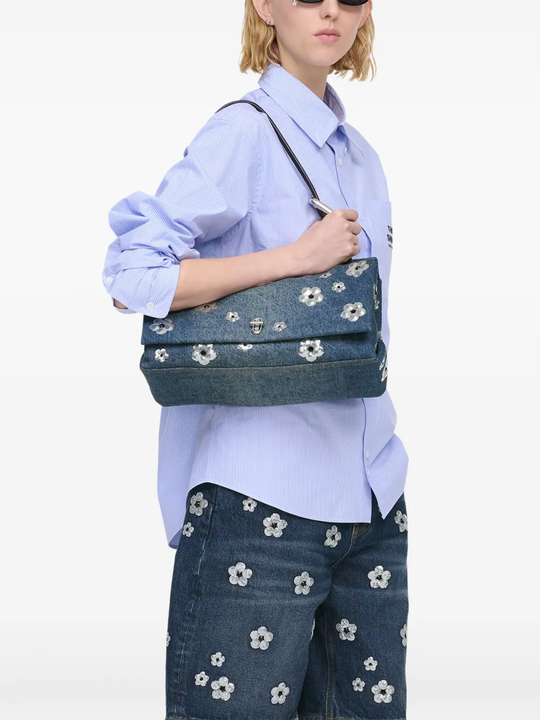 Blue bag worn by a person, showing the bag fit