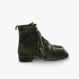 Green boots, side view