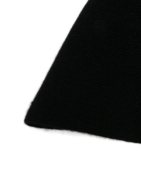 Close up of black hats, showing texture of the cashmere fabric