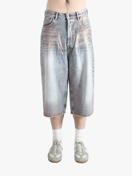 Blue shorts worn by a person, showing the shorts fit