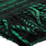 Close up of Green scarf, showing texture of the 89% virgin wool/ 4% alpaca wool/ 4% mohair/ 3% polyester made in fabric