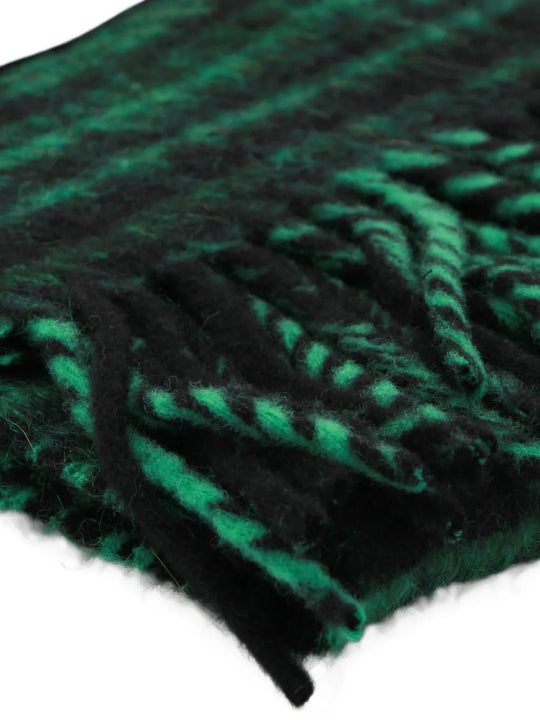 Close up of Green scarf, showing texture of the 89% virgin wool/ 4% alpaca wool/ 4% mohair/ 3% polyester made in fabric