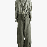 Green pants worn by a person, showing the pants's fit