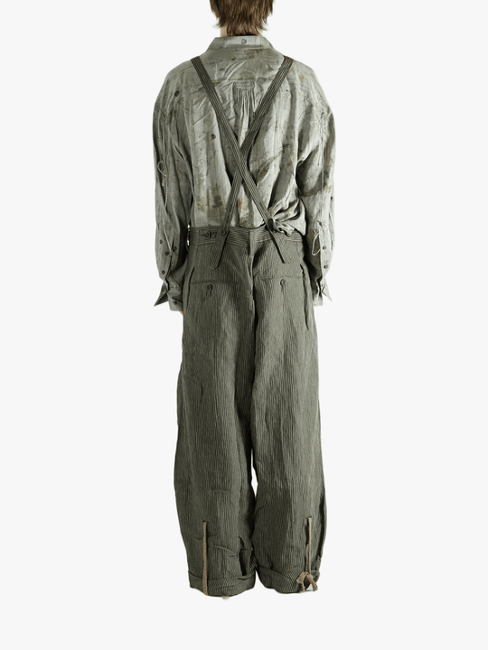 Green pants worn by a person, showing the pants's fit