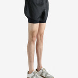 Black shorts worn by a person, showing the shorts fit