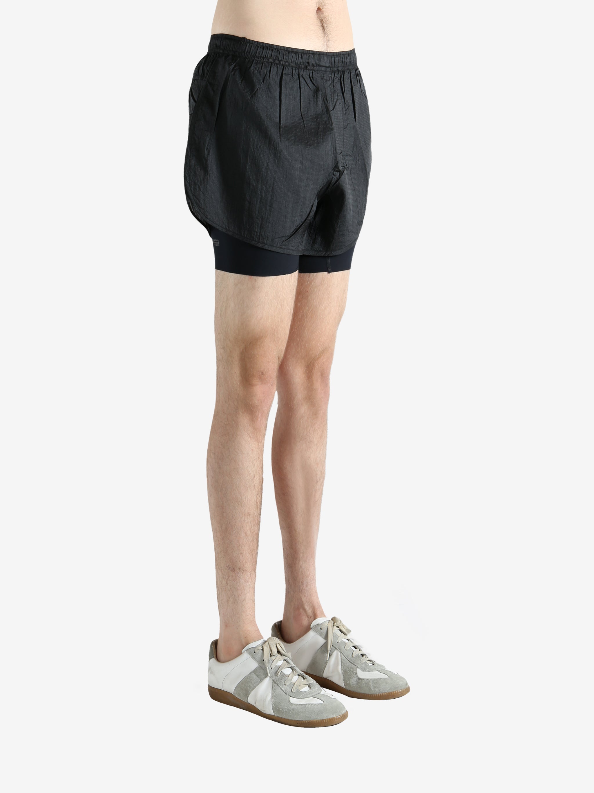 Black shorts worn by a person, showing the shorts fit