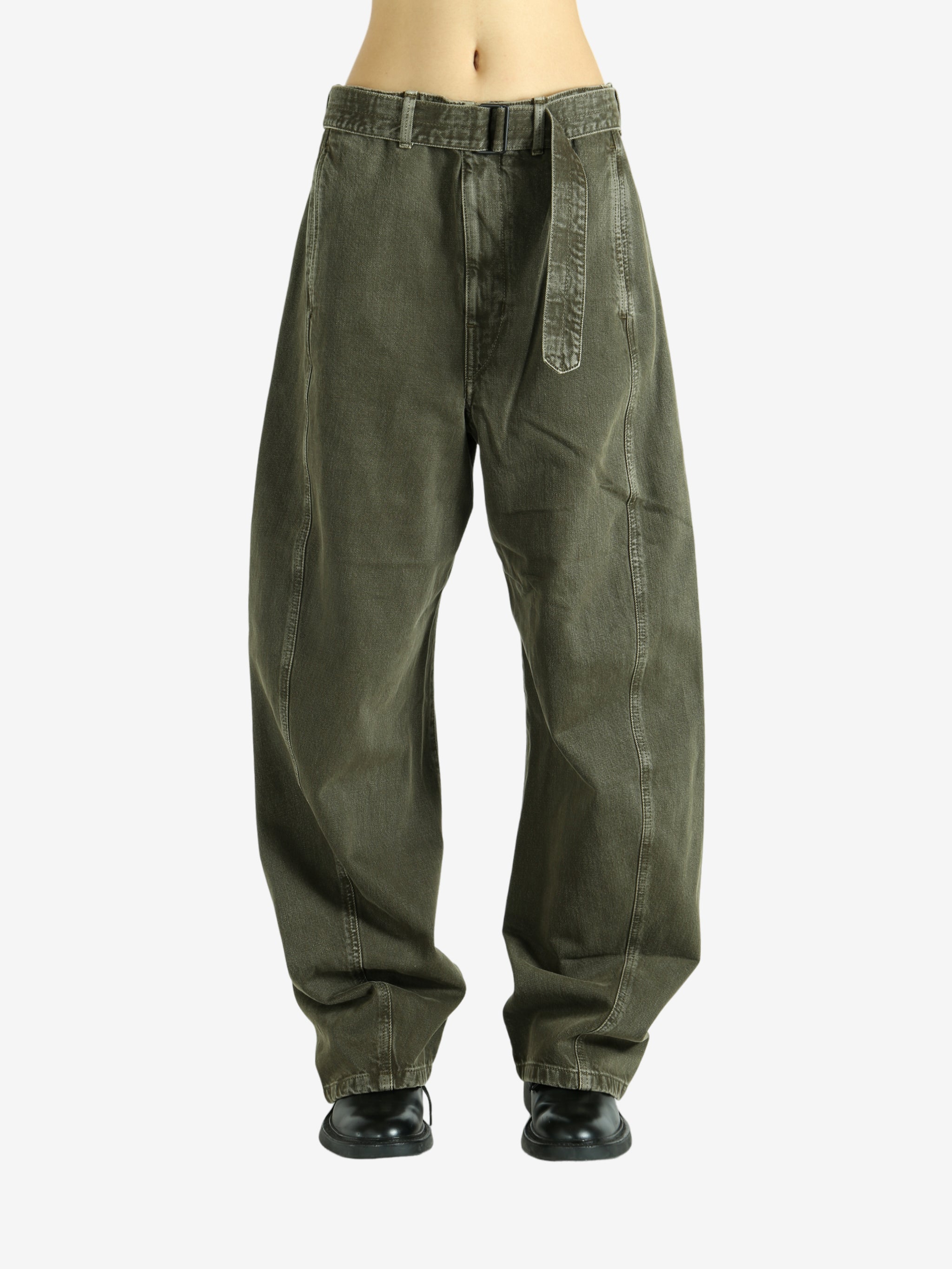 Green pants worn by a person, showing the pants fit