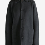 Grey jacket worn by a person, showing the jacket's fit