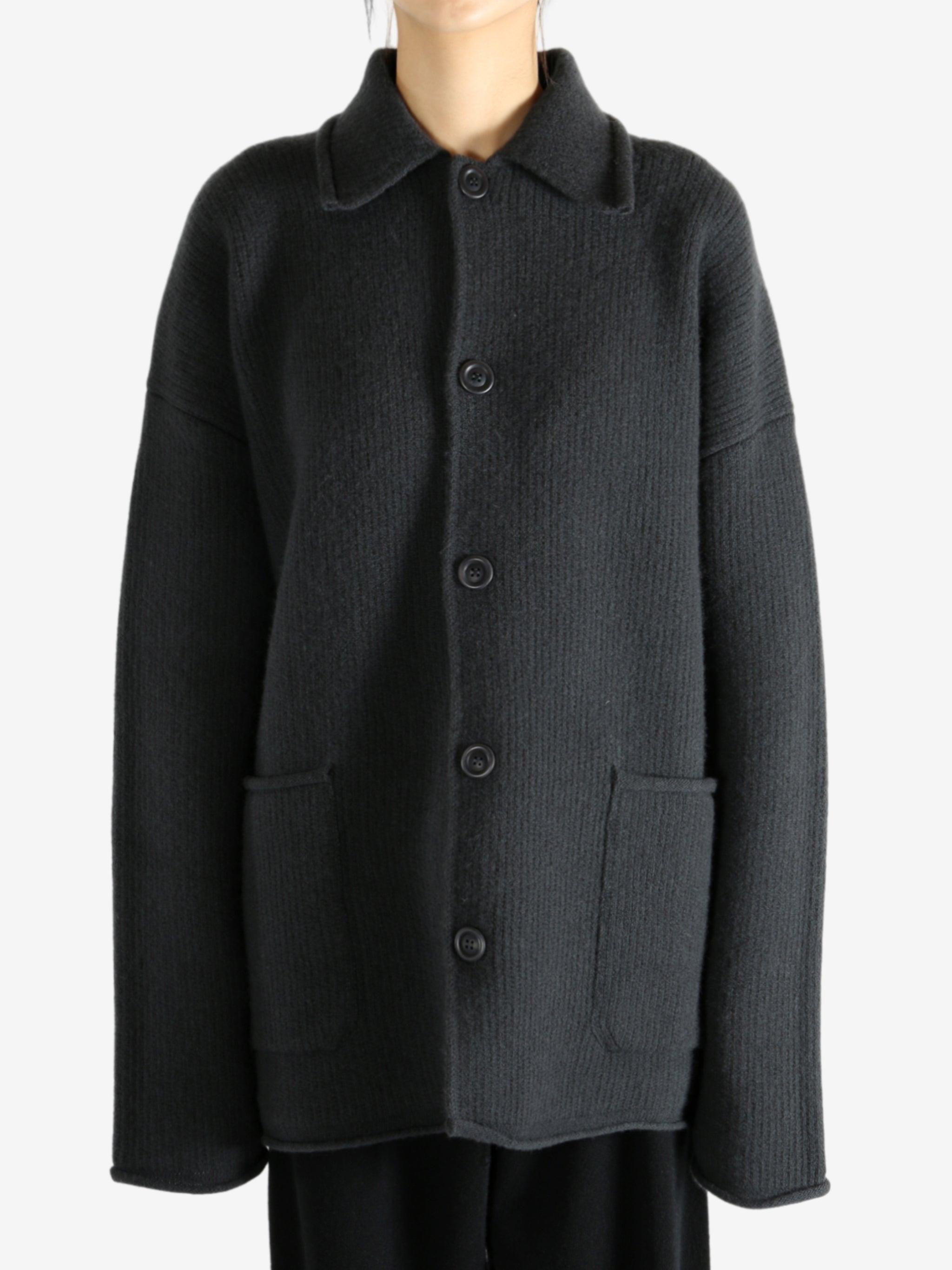 Grey jacket worn by a person, showing the jacket's fit