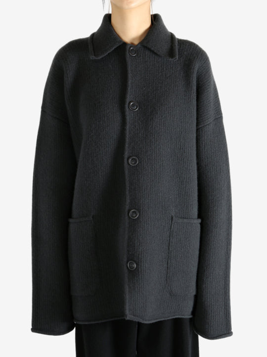 Grey jacket worn by a person, showing the jacket's fit