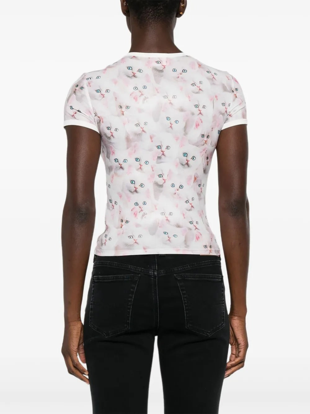 White t-shirt worn by a person, showing the shirt's fit