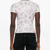 White t-shirt worn by a person, showing the shirt's fit