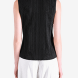 Black shirt worn by a person, showing the shirt fit