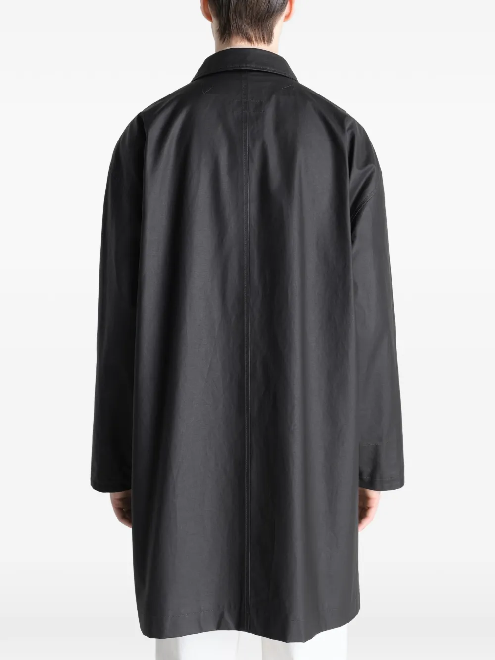 Black jacket worn by a person, showing the jacket's fit