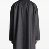 Black jacket worn by a person, showing the jacket's fit