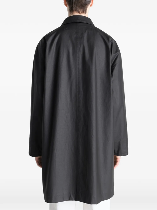 Black jacket worn by a person, showing the jacket's fit
