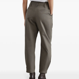 Green pants worn by a person, showing the pants fit