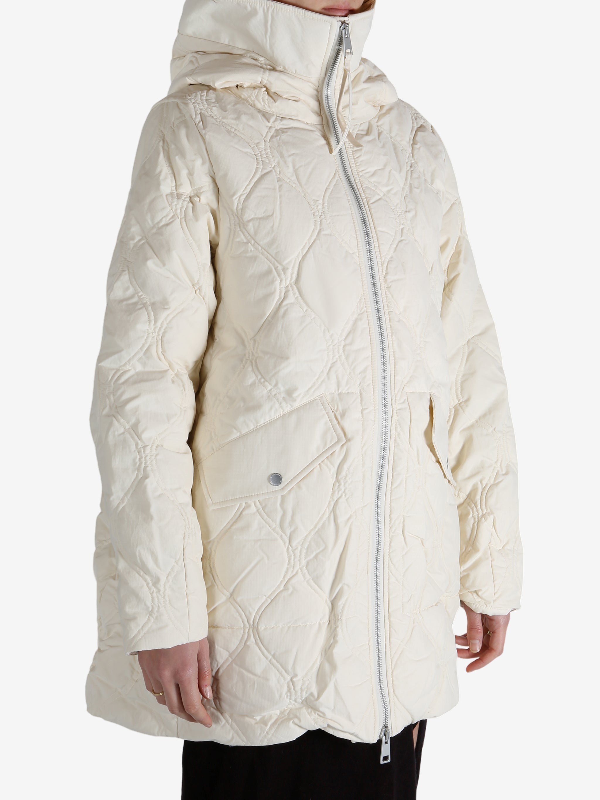 White coat worn by a person, showing the coat fit