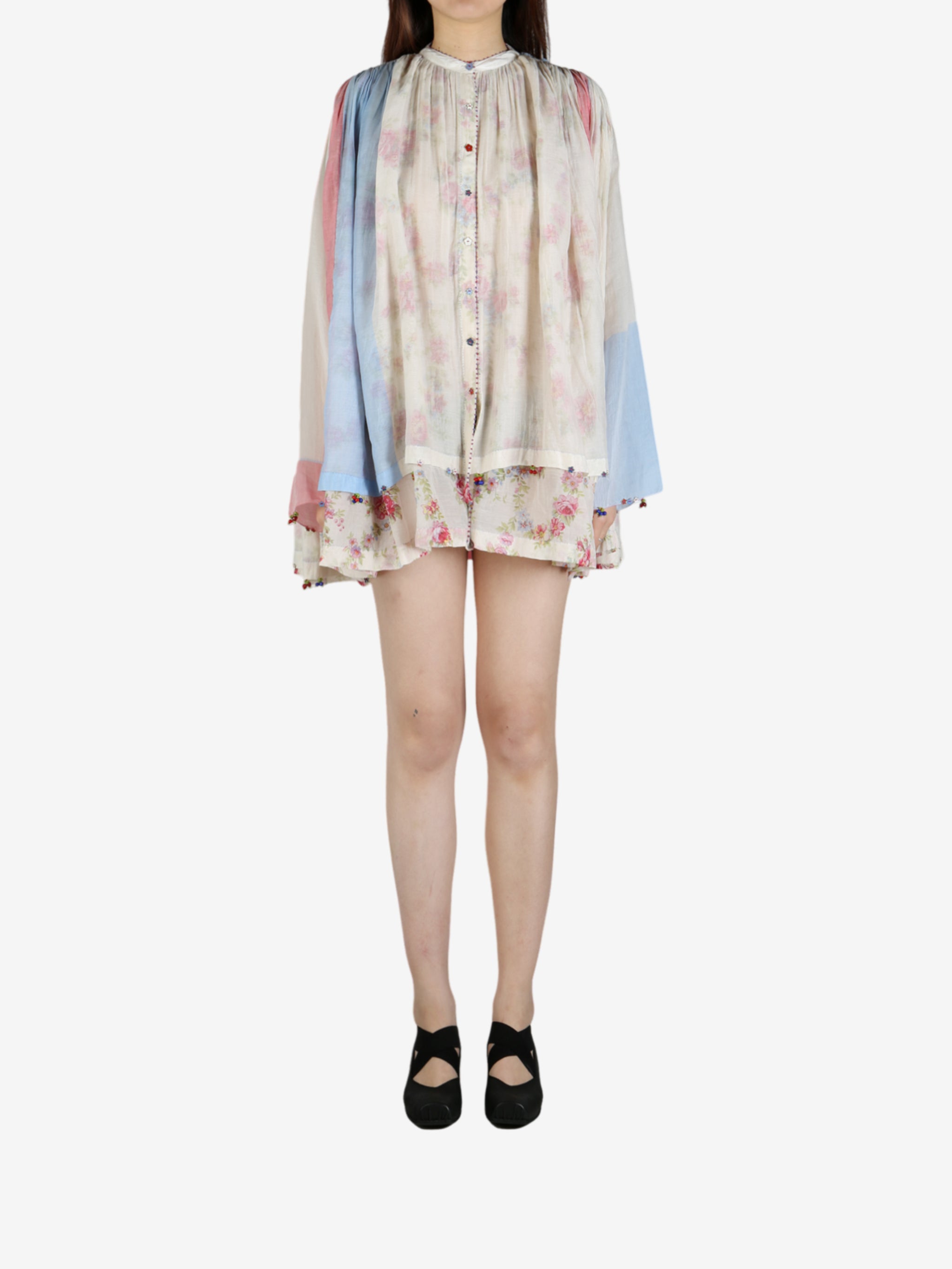 Tan shirt worn by a person, showing the shirt’s fit