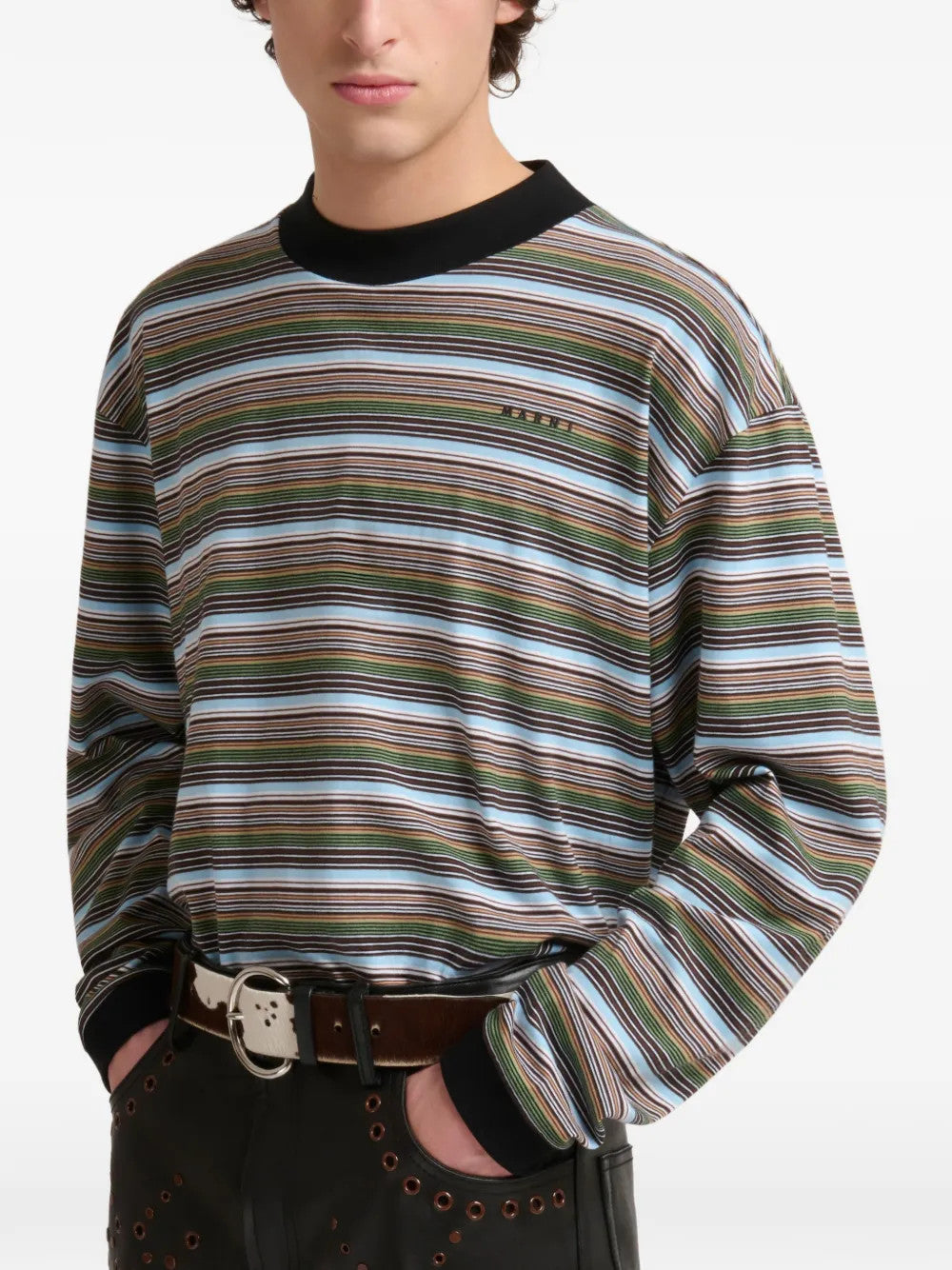 Green t-shirt worn by a person, showing the t-shirt fit