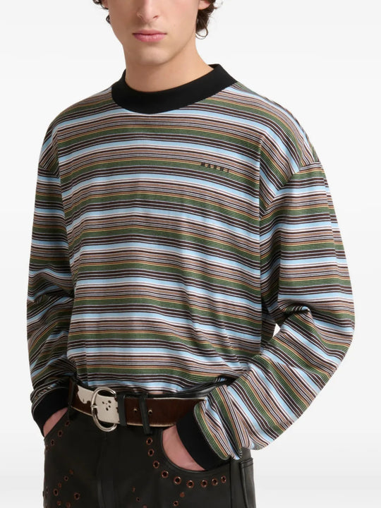 Green t-shirt worn by a person, showing the t-shirt fit