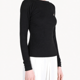 Black top worn by a person, showing the top fit