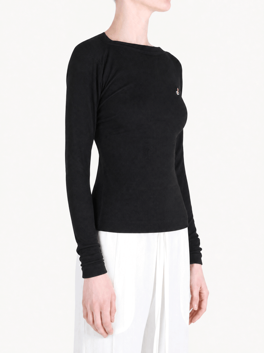 Black top worn by a person, showing the top fit