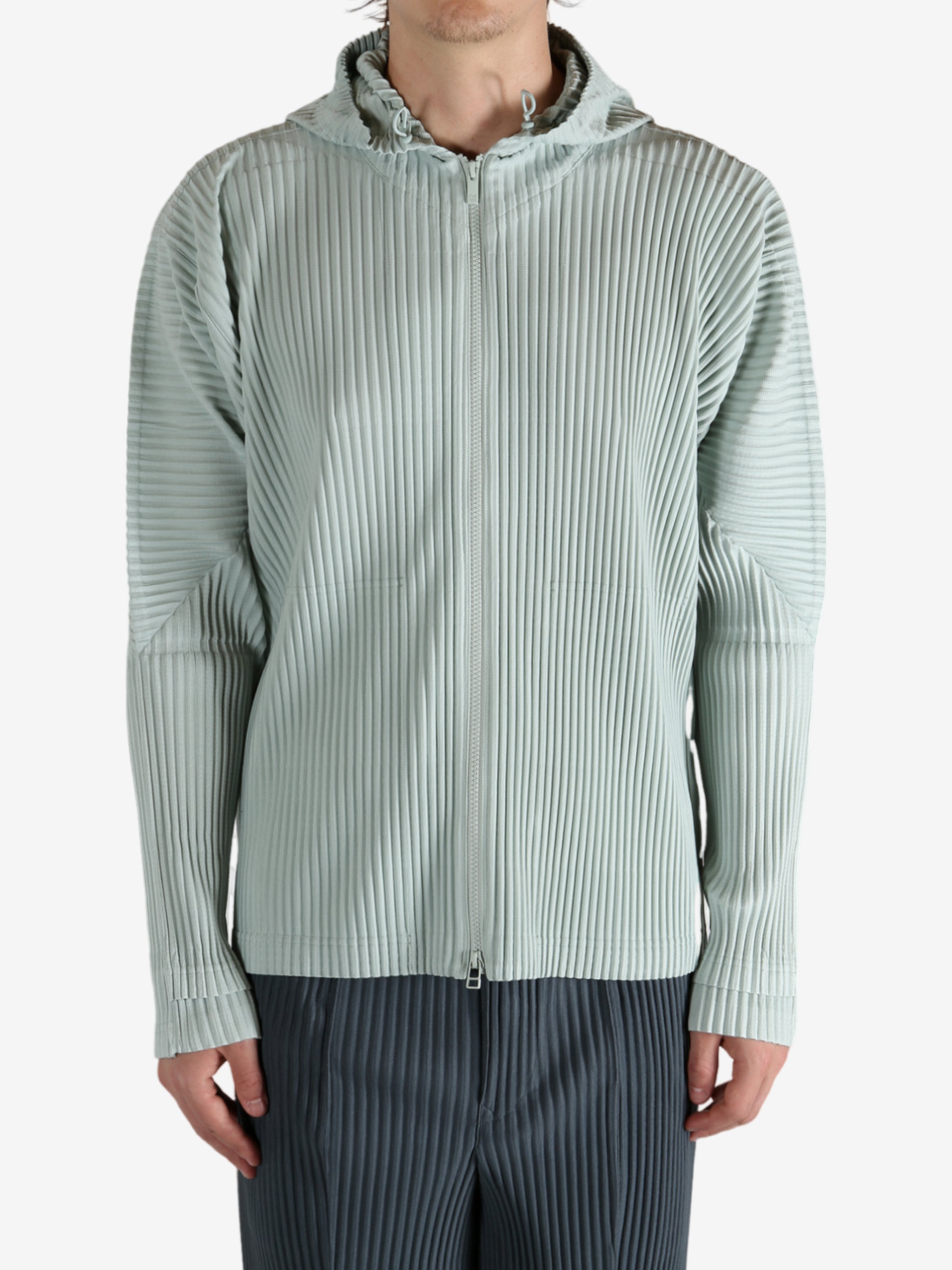 Blue jacket worn by a person, showing the jacket's fit