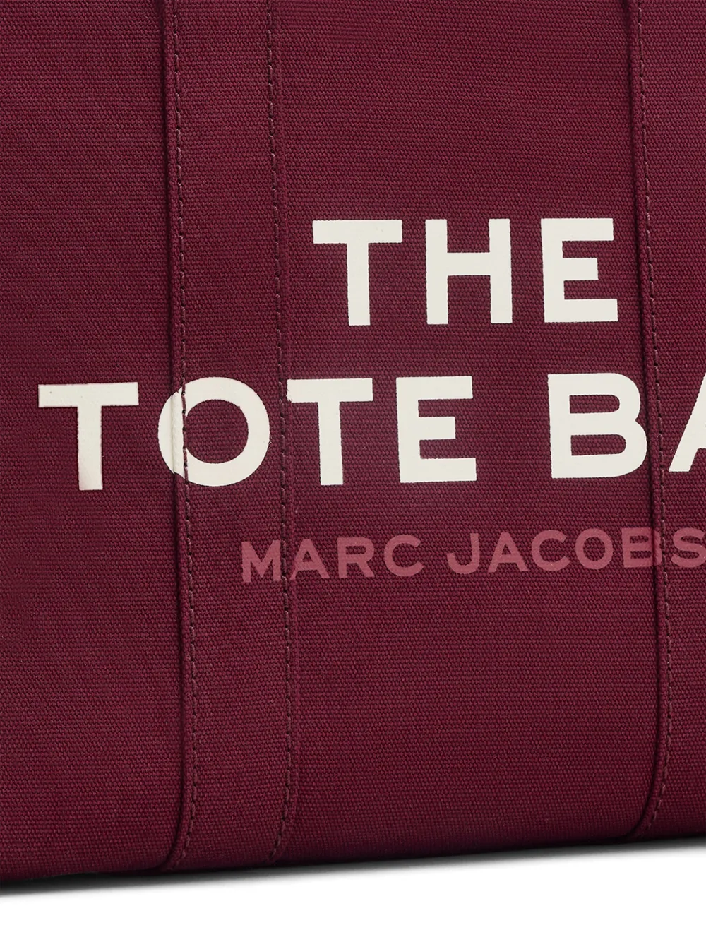 Close up of burgundy bag, showing texture of the cotton fabric