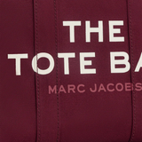 Close up of burgundy bag, showing texture of the cotton fabric