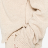 Close up of tan top,showing texture of the cashmere fabric.