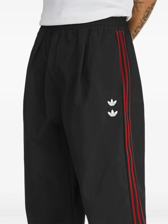 Black pants worn by a person, showing the pants fit