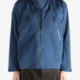 Navy jacket worn by a person, showing the jacket  fit